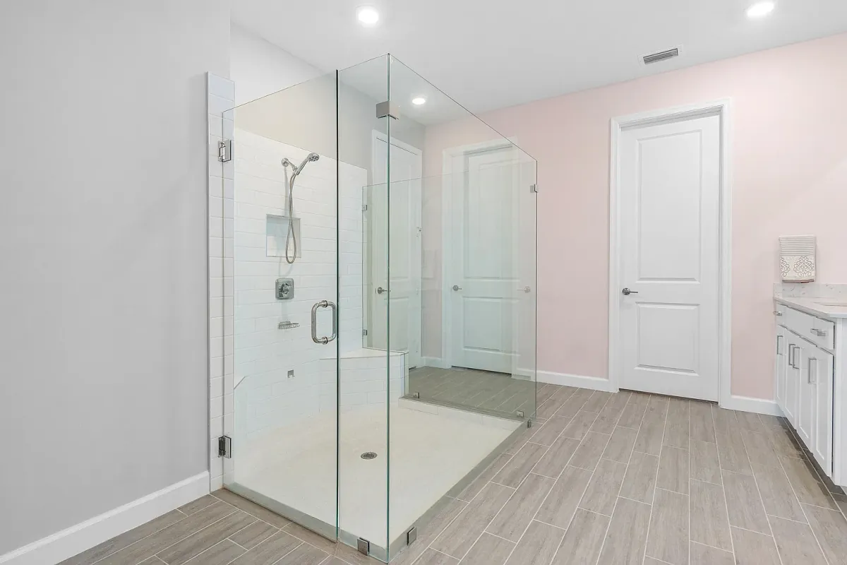 Full bathroom with a glass-enclosed shower