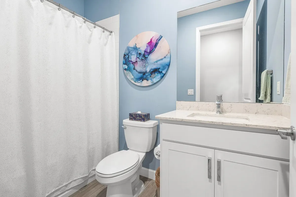 Full bathroom with vanity and tub-shower combination