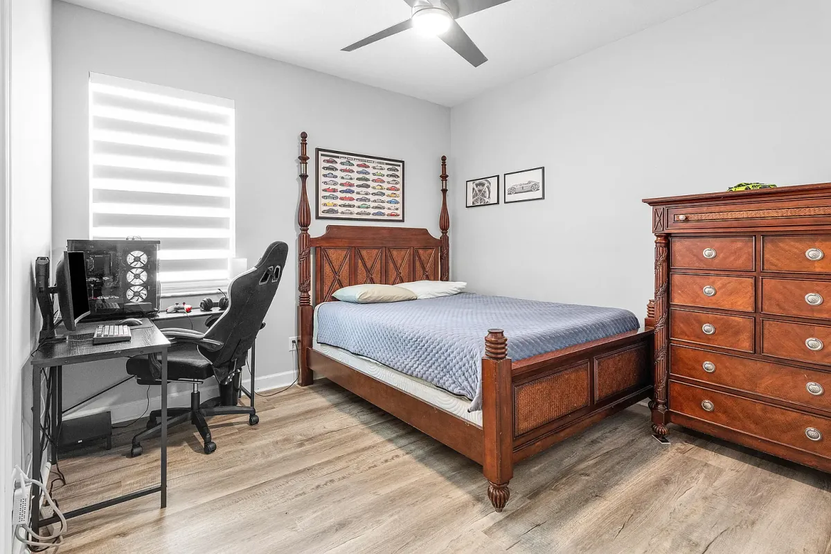 Bedroom currently set up with a desk and workspace