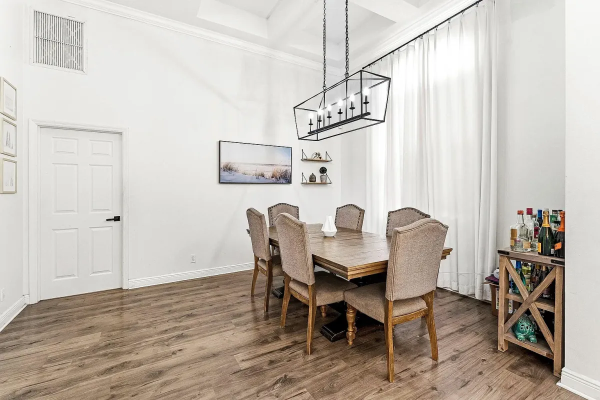 Dining room with a full-size table and linear pendant light