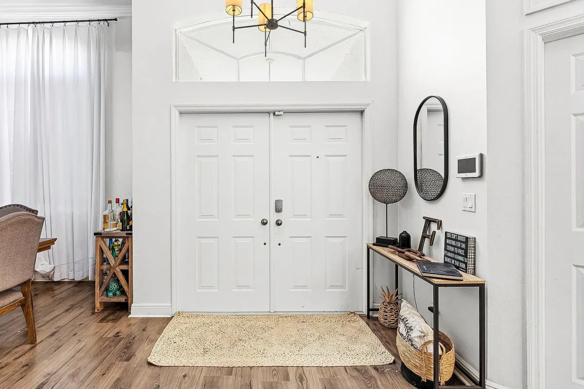 Entry foyer with double front doors and tray ceiling